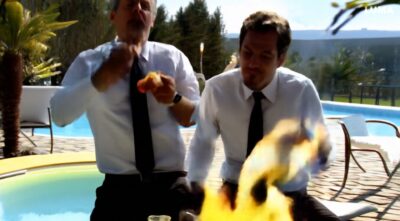 these_two_men_eating_chicken_while_the_world_burns_down_9afffd